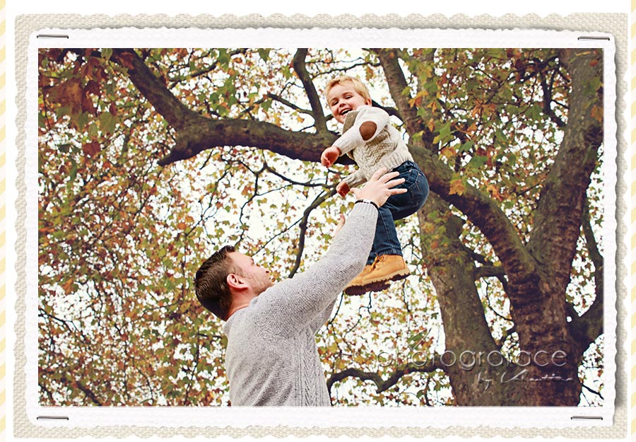dad throwing son up in the air while having fun during a family photography session